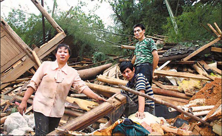 Residents of Fendang village in Nanping, Fujian province, clear debris on June 26 after a landslide destroyed their homes.
