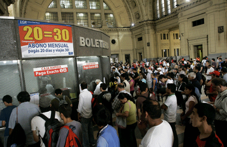 People wait to buy tickets in a subway station in Buenos Aires, Argentina, on January 13, 2009. Argentina government cut the subsidies to public output and encouraged citizens to spend more money to counteract the challenge of the financial crisis. The carfare of Argentina&apos;s public traffic raised since Tuesday. 