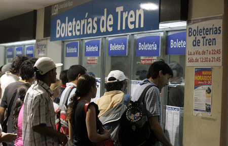 People wait to buy tickets in a subway station in Buenos Aires, Argentina, on January 13, 2009.