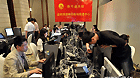 Journalists are seen at the working area of Xinhua News Agency in the media centre of the BRICS Leaders Meeting in Sanya, south China's Hainan Province, April 13, 2011.