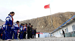 Students mourn for the earthquake victims at a primary school in Yushu Tibetan Autonomous Prefecture, northwest China's Qinghai Province, April 14, 2011.