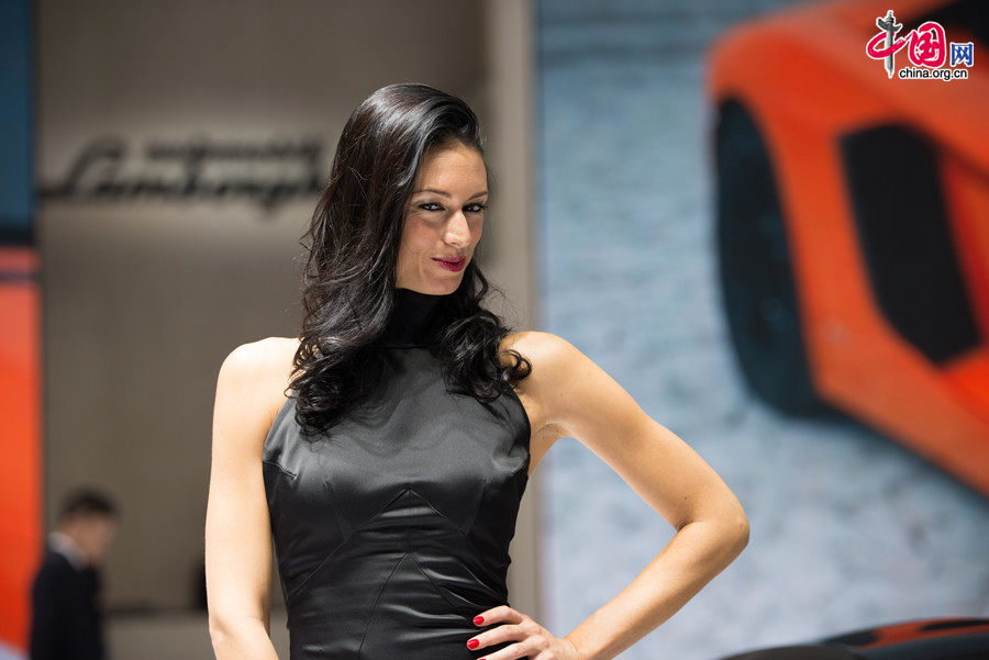 A car model poses for photo on Monday, April 21, 2014, at the 2014 Beijing International Automotive Exhibition, which officially opens to public on this day. The auto expo will last until April 29. [Photo by Chen Boyuan / China.org.cn]