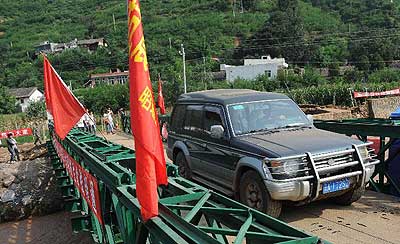 鲁甸地震造成589人遇难，龙泉河桥架起了物资输入震中的道路