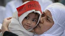 Muslim women and children hold a demonstration to protest against the continued Israeli airstrikes on the Gaza Strip, in Taguig City, the Philippines, on January 2, 2009.