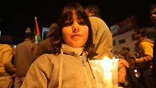 A Palestinian girl holds a candle at a demonstration in downtown Ramallah against Israel's ground operation on the Gaza Strip, on January 3, 2009.