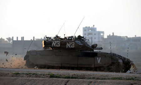 An Israeli tank passes across Gaza City on January 8, 2009.