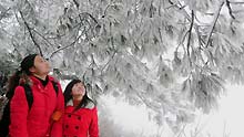 Tourists view the rime scenery at Meiling Mountain Senic Area in Nanchang, capital of east China's Jiangxi Province, on January 7, 2009. The temperature of southern China remained vert low recently, which caused the rare rime scenery in Nanchang.