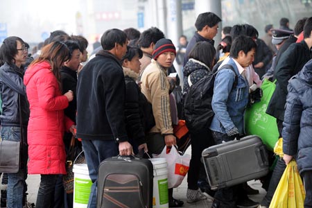 Passengers enter the Nanjing Railway Station in Nanjing, capital of east China's Jiangsu Province, on January 8, 2009. During the Spring Festival travel period this year, known as Chunyun in Chinese, more than 6.19 million person-time is expected to depart from Nanjing, over 2.71 million of whom would depart by train, according to the Chunyun Affairs Office of Nanjing on January 1.