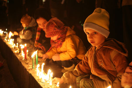 Irani children light candles while praying for the children in Gaza during a rally at the Palestine Square in Tehran, capital of Iran, on January 7, 2009. Thousands of Irani people gathered at the square Wednesday night to support the Palestinian people. 