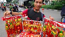 A peddler displays decorations at the Chinatown in Jakarta, captial of Indonesia, on January 8, 2009. As the traditional Chinese Spring Festival is coming, red lanterns, mascots and various decorations come into market in Jakarta.