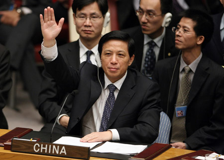 Zhang Yesui, Chinese Permanent Representative to the United Nations, votes for approval of the resolution calling for ceasefire between Israel and Hamas in Gaza during the United Nations Security Council meeting on Gaza crisis at the UN headquarters in New York, the United States, on January 8, 2009.