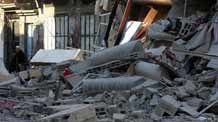 An old man sits beside the remains of the house of Abu Obieda al-Jarah, a senior Hamas leader and deputy police chief in the Gaza Strip, after an Israeli air strike, in Gaza City, January. 9, 2009.