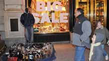 Photo taken on December 25, 2008 shows an unlicensed vendor selling bags on a street in New York, the United States. The unemployment rate of the United States reached 7.2 percent in December, 2008, a nearly 16-year high, as non-agricultural employers slashed 524,000 jobs, bringing the job losses in 2008 to 2.6 million, the Labor Department said on Friday. [Xinhua]