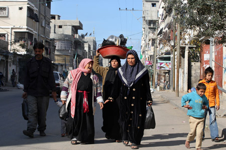 Palestinians flee after Israel's offensive in Gaza, Jan. 9, 2009.