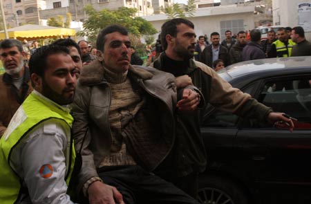 A wounded Palestinian man is sent to the Kamal Adwan hospital after an Israeli air strike on January 11, 2009 in Beit Lahia, Gaza Strip. Israel's ongoing attacks on Hamas targets in the Gaza Strip have claimed almost 900 lives. [Xinhua]