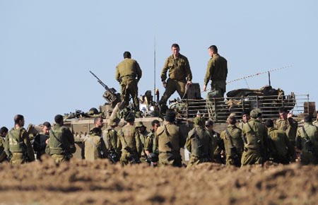 Israeli soldiers stand together during training on January 10, 2009. The Israel Defense Forces (IDF) on Sunday has begun sending its reservists into the Gaza Strip, signaling an expansion of the IDF ground incursion in the Hamas-ruled coastal enclave.