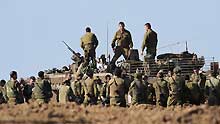 Israeli soldiers stand together during training on January 10, 2009. The Israel Defense Forces (IDF) on Sunday has begun sending its reservists into the Gaza Strip, signaling an expansion of the IDF ground incursion in the Hamas-ruled coastal enclave.