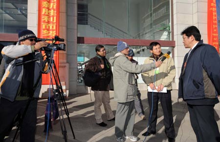 Foreign reporters interview a member of Tibetan Regional Committee of the Chinese People's Political Consultative Conference in Lhasa, capital of southwest China's Tibet Autonomous Region, on January 12, 2009.