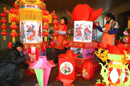 Workers make lanterns at a workshop at Hongmiao Village in Huairou District of Beijing, capital of China, on January 12, 2009. Some 2,200 lanterns have been made at the workshop for the Spring festival since the beginning of the last month of the lunar year.