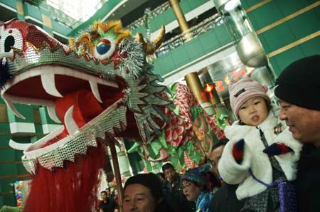 People attend a culture festival with the theme of greeting the Spring Festival in Xinghai Exhibition Center in Dalian, northeast China's Liaoning Province, on January 13, 2009. The Spring Festival, or the Chinese lunar New Year, falls on January 26 this year.