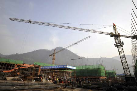 Photo taken on January 12, 2009 shows the building site of an elementary school in Leigu Town of Beichuan County, pounded by the May 12 devastating earthquake last year, southwest China's Sichuan Province. People in Beichuan had engaged in reconstructing their hometown with 47,814 farmers' houses completed or being built, which account for 76 percent of the total.