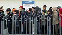 People stand in line for tickets at the Beijing West Railway Station in Beijing, capital of China, on January 13, 2009, as the traditional Chinese Lunar New Year approaches.