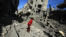 Palestinians inspect the rubble of a destroyed building following the Israeli military operations in Gaza City on January 14, 2009. [Xinhua]