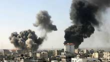 Smoke rises following explosions from an Israeli airstrike in Rafah, in the southern Gaza Strip, on January 13, 2009.