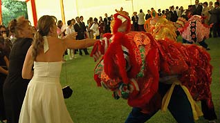 Overseas Chinese perform traditional lion dance during a Spring Festival reception at Chinese Embassy in Lima, Peru, on January 13, 2009. Chinese Ambassador to Peru Gao Zhengyue held a reception to celebrate the upcoming Chinese lunar New Year, with the attendance of more than 400 people including Peruvian Interior Minister Remigio Hernani and other govenmental officials, representatives of friendly groups and Chinese enterprises. [Xinhua]