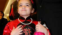 Jacqueline takes part in the Lunar New Year reception in Chinese costume with her father in New York, the United States, on January 14, 2009. Chinese Consulate General in New York and the delegation of China to the United Nations held a reception to celebrate the coming Chinese Lunar New Year.