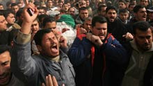 Palestinian Hamas members carry the body of Hamas Interior Minister Said Siam during his funeral in Gaza City, on January 16, 2009. Said Siam was killed on Thursday while hiding in his brother's home in Gaza City.