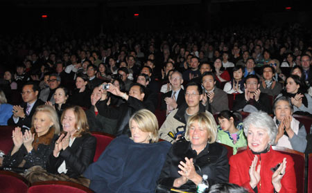 People applaud as they watch Chinese Kung Fu show 'Soul of Shaolin' at Broadway's Marquis Theater in New York on January 15, 2009.