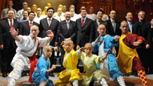 Performers of Chinese Kung Fu show 'Soul of Shaolin' pose with guests after their debut at Broadway's Marquis Theater in New York on January 15, 2009. The 'Soul of Shaolin' was officially opened at Broadway Thursday night, attracting a large audience and prompting local leaders to hail the 'China on Broadway Day.'