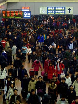 People enter the Beijing West Railway Station in Beijing, capital of China, on January 17, 2009. Tens of millions of Chinese are traveling to their home towns or vacation spots for the Lunar New Year, or the Spring Festival, which falls on January 26 this year.