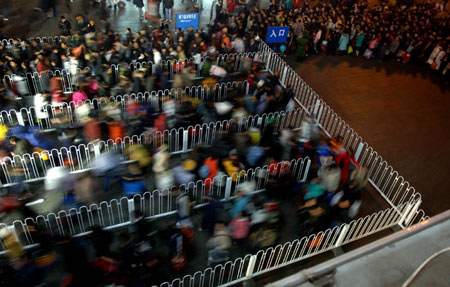 People enter the Beijing West Railway Station in Beijing, capital of China, on January 17, 2009. Tens of millions of Chinese are traveling to their home towns or vacation spots for the Lunar New Year, or the Spring Festival, which falls on January 26 this year.