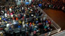 People enter the Beijing West Railway Station in Beijing, capital of China, on January 17, 2009. Tens of millions of Chinese are traveling to their home towns or vacation spots for the Lunar New Year, or the Spring Festival, which falls on January 26 this year.