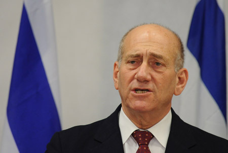 Israeli Prime Minister Ehud Olmert speaks at a press conference after security cabinet meeting in Tel Aviv, on January 17, 2008. Israeli Prime Minister Ehud Olmert Saturday evening declared a unilateral ceasefire in the Hamas-ruled Gaza Strip, beginning from 2:00 AM (0000 GMT) on Sunday.