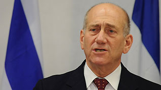 Israeli Prime Minister Ehud Olmert speaks at a press conference after security cabinet meeting in Tel Aviv, on January 17, 2008. Israeli Prime Minister Ehud Olmert Saturday evening declared a unilateral ceasefire in the Hamas-ruled Gaza Strip, beginning from 2:00 AM (0000 GMT) on Sunday.