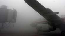 Heavy fog blankets Shuangliu International Airport in Chengdu, capital of southwest China's Sichuan Province, on January 19, 2009. Shuangliu International Airport was closed Sunday for more than five hours due to heavy fog, delaying about 200 incoming and outgoing flights and stranding more than 15,000 passengers.