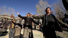 Villagers of the Tibetan ethnic group dance to celebrate the setting of the Serfs Emancipation Day in Banjorihunbo Village of southwest China's Tibet Autonomous Region, on January 19, 2009.