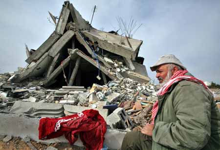 A Palestinian returns to their destroyed houses by Israeli strikes in the east of northern Gaza Strip, on January 19, 2009. Right after a ceasefire was declared by both Israel and Gaza militant groups, thousands of Gaza residents went back to their homes they had fled during the war, only to see how huge the destruction was.