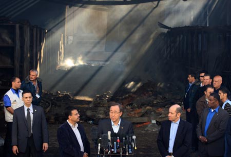 United Nations Secretary-General Ban Ki-moon (C) makes a speech during his visit to the damaged UN compound in Gaza City, on January 20, 2009. Ban Ki-moon on Tuesday visited the UN offices seriously damaged in recent Israeli military attacks on the Gaza Strip, saying the cycle of violence in the territory must end. Ban Ki-moon also called on Israel and Hamas to show restraint and observe their cease-fire.