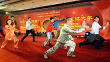 Foreign tourists learn Taiji, also known as shadowboxing, during a celebration for the Chinese lunar New Year in a community in the Chaoyang District of Beijing, capital of China, on January 20, 2009.