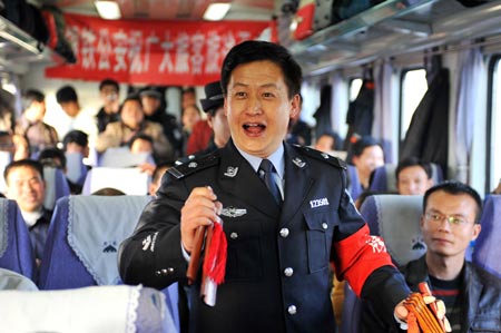 A trainman performs traditional clapper ballad for passengers on the train from Beijing, capital of China, to Yinchuan, capital of northwest China's Ningxia Hui Autonomous Region, on January 20, 2009. The 40-day travel peak around the Spring Festival holidays began on January 11, during which some 2.32 billion trips are expected to take place for the Chinese lunar New Year starting from January 26.