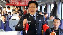 A trainman performs traditional clapper ballad for passengers on the train from Beijing, capital of China, to Yinchuan, capital of northwest China's Ningxia Hui Autonomous Region, on January 20, 2009. The 40-day travel peak around the Spring Festival holidays began on January 11, during which some 2.32 billion trips are expected to take place for the Chinese lunar New Year starting from January 26.