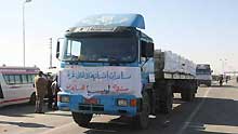 Trucks loaded with humanitarian aids wait outside Rafah Crossing at the Egyptian-Gaza border, on January 21, 2009.