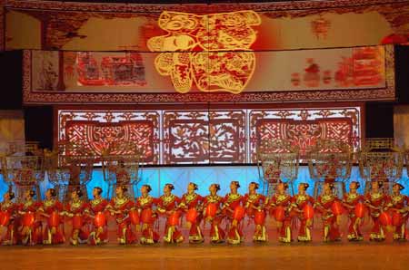 Performers from north China's Shanxi Province dance during a dress rehearsal in China's biggest TV station, CCTV, in Beijing, capital of China, on January 3, 2009.