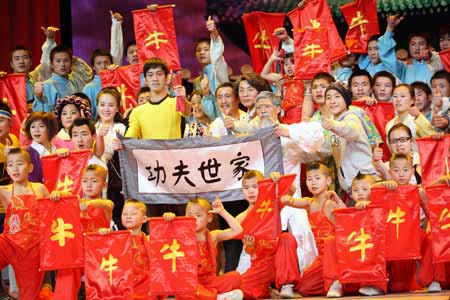 Performers pose after wushu performance during a dress rehearsal in China's biggest TV station, CCTV, in Beijing, capital of China, on January 13, 2009.