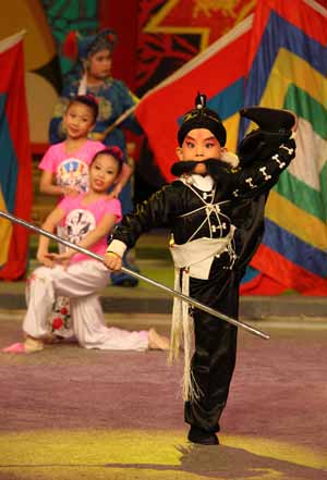 Yang Bohao, a young Chinese opera performer, performs during a dress rehearsal in China's biggest TV station, CCTV, in Beijing, capital of China, on January 9, 2009.