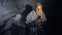 Homeless Palestinian Muhammed Abdu-Rabi sits at his temporary shelter in Gaza, on January 22, 2009. Muhammed lost two daughters and his house in the conflict.